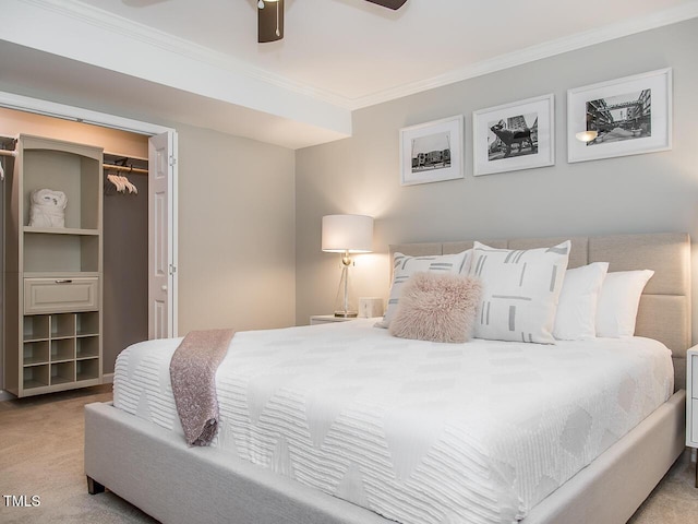 3009 Omah St, Durham, NC 27705 - carpeted bedroom featuring crown molding, ceiling fan, a closet, and a walk in closet