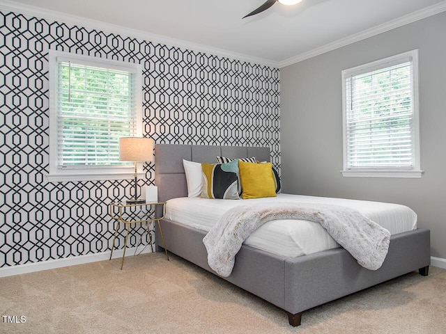 3009 Omah St, Durham, NC 27705 - bedroom featuring crown molding, multiple windows, carpet, and a ceiling fan
