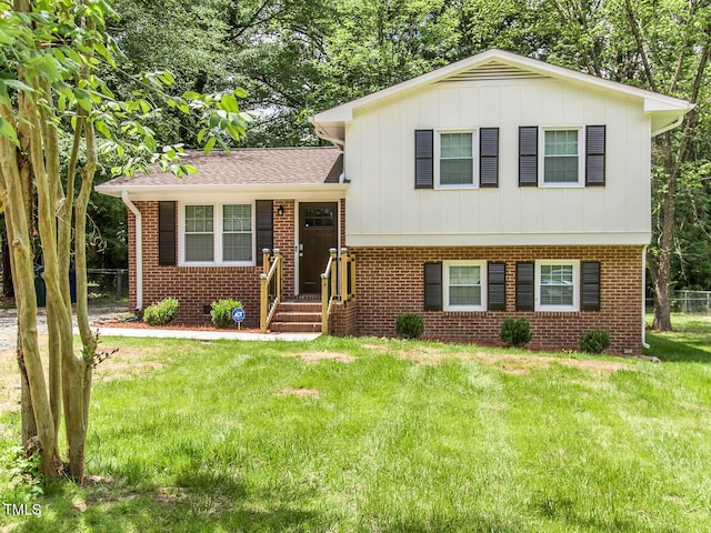 3009 Omah St, Durham, NC 27705 - tri-level home with board and batten siding and brick siding