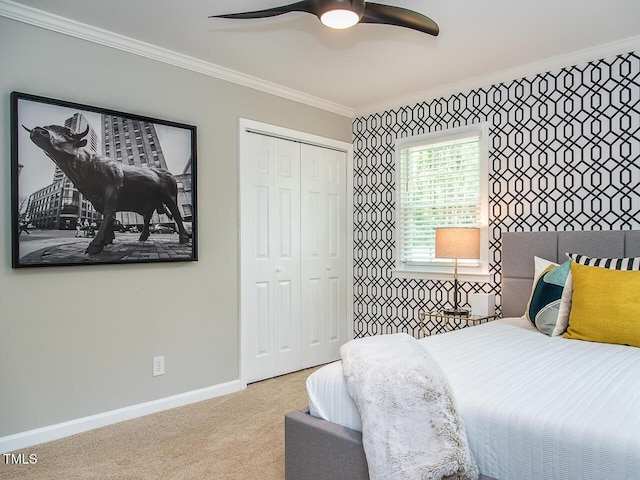 3009 Omah St, Durham, NC 27705 - bedroom featuring ornamental molding, carpet floors, a closet, and ceiling fan