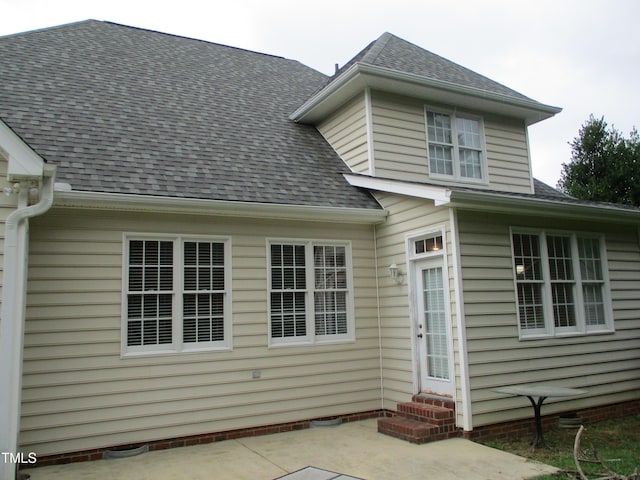 4817 Tupenny Ln, Raleigh, NC 27606 - rear view of property with entry steps, a patio area, and roof with shingles