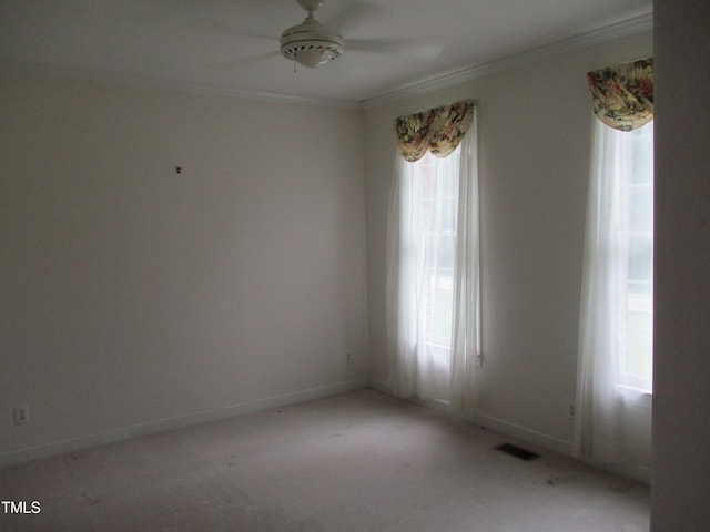 4817 Tupenny Ln, Raleigh, NC 27606 - unfurnished room with ornamental molding, a ceiling fan, and light carpet