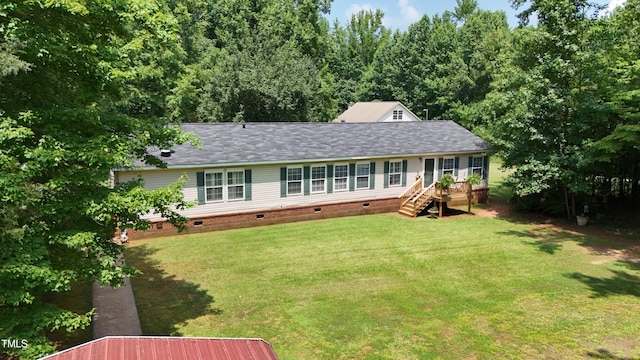 205 N Raleigh Farms Rd, Youngsville, NC 27596 - back of house featuring crawl space, a lawn, a wooden deck, and a shingled roof