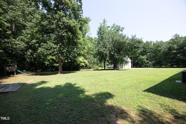 205 N Raleigh Farms Rd, Youngsville, NC 27596 - view of green lawn featuring a playground