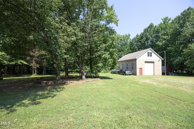 205 N Raleigh Farms Rd, Youngsville, NC 27596 - view of grassy yard with a garage and an outdoor structure