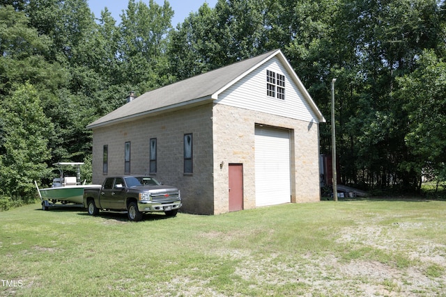 205 N Raleigh Farms Rd, Youngsville, NC 27596 - detached garage featuring view of wooded area