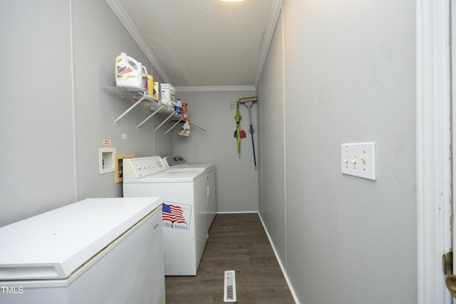 205 N Raleigh Farms Rd, Youngsville, NC 27596 - washroom featuring washing machine and clothes dryer, a textured ceiling, dark wood finished floors, and crown molding