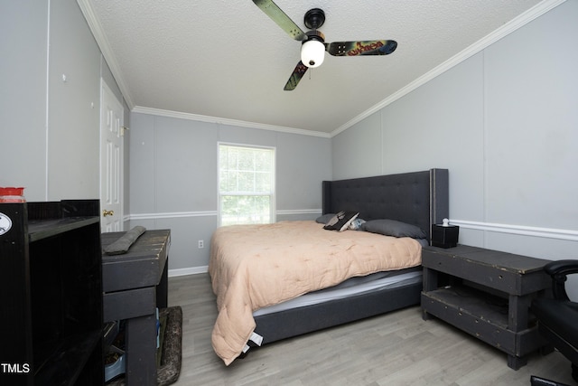 205 N Raleigh Farms Rd, Youngsville, NC 27596 - bedroom featuring wood finished floors, crown molding, a textured ceiling, and a ceiling fan