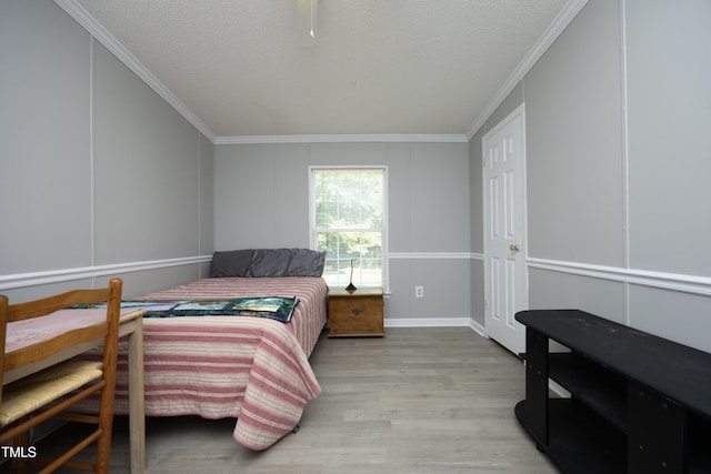 205 N Raleigh Farms Rd, Youngsville, NC 27596 - bedroom featuring crown molding, wood finished floors, and a textured ceiling