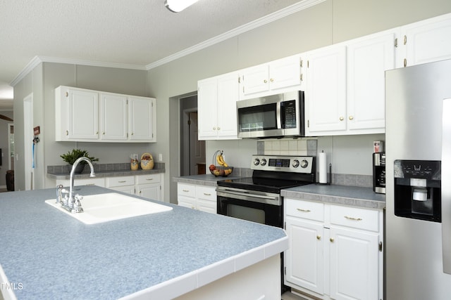 205 N Raleigh Farms Rd, Youngsville, NC 27596 - kitchen featuring appliances with stainless steel finishes, crown molding, white cabinets, and a textured ceiling