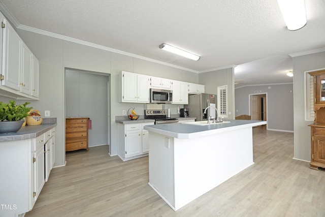 205 N Raleigh Farms Rd, Youngsville, NC 27596 - kitchen with stainless steel appliances, crown molding, light wood finished floors, a center island with sink, and white cabinets