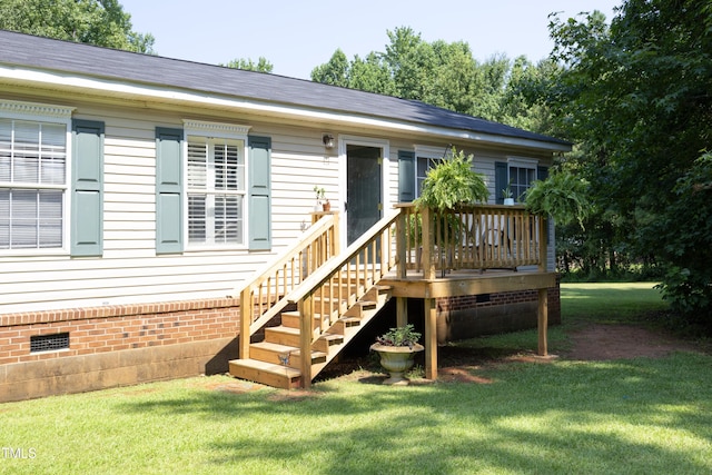 205 N Raleigh Farms Rd, Youngsville, NC 27596 - rear view of property featuring crawl space, a yard, and a wooden deck