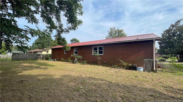 1034CRAYTONCIRCLE Crayton Cir, Fayetteville, NC 28314 - rear view of property featuring a metal roof, brick siding, and crawl space