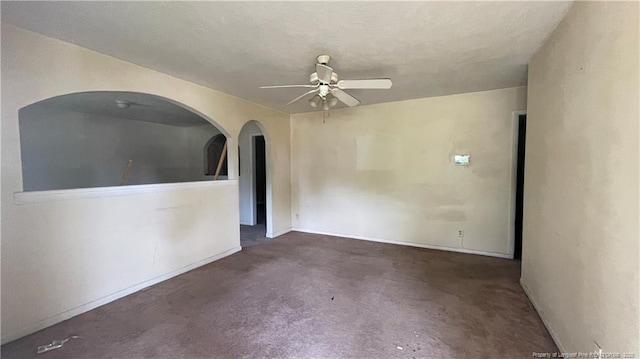 1034CRAYTONCIRCLE Crayton Cir, Fayetteville, NC 28314 - unfurnished room featuring arched walkways, ceiling fan, and carpet