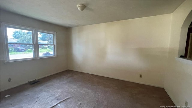 1034CRAYTONCIRCLE Crayton Cir, Fayetteville, NC 28314 - unfurnished room with arched walkways and carpet flooring