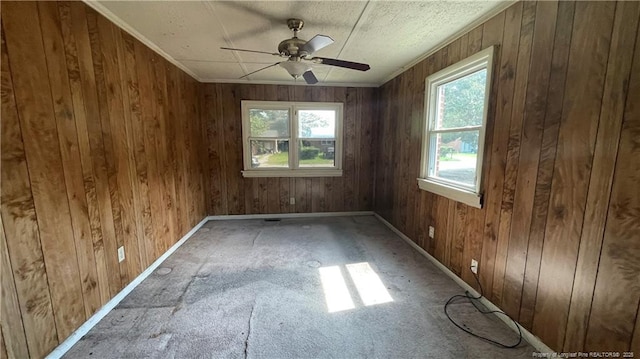 1034CRAYTONCIRCLE Crayton Cir, Fayetteville, NC 28314 - empty room with wooden walls and a ceiling fan