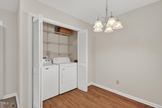10 Tarawa Ter, Durham, NC 27705 - washroom with a chandelier, independent washer and dryer, and light wood-type flooring