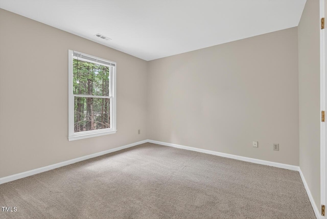 10 Tarawa Ter, Durham, NC 27705 - empty room with baseboards and carpet flooring