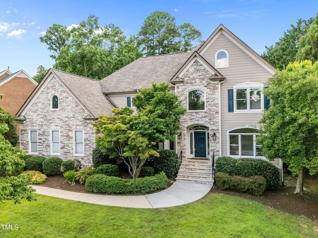 202 Bridewell Ct, Cary, NC 27518 - french country style house with a front lawn and stone siding