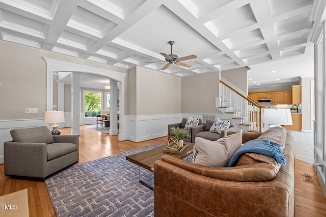 202 Bridewell Ct, Cary, NC 27518 - living room with light wood-style flooring, decorative columns, coffered ceiling, ceiling fan, and beamed ceiling
