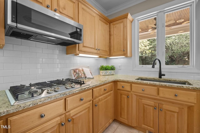 202 Bridewell Ct, Cary, NC 27518 - kitchen featuring appliances with stainless steel finishes, tasteful backsplash, light stone counters, and ornamental molding