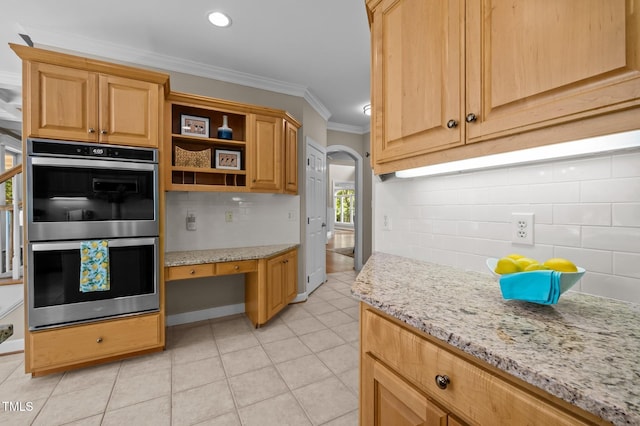 202 Bridewell Ct, Cary, NC 27518 - kitchen featuring stainless steel double oven, ornamental molding, tasteful backsplash, light tile patterned floors, and arched walkways