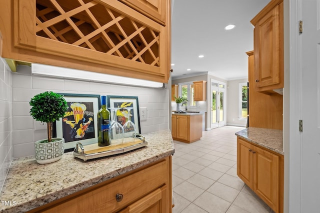 202 Bridewell Ct, Cary, NC 27518 - bar area featuring decorative backsplash, crown molding, light tile patterned floors, and recessed lighting