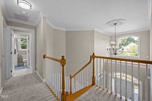 202 Bridewell Ct, Cary, NC 27518 - hall with an upstairs landing, plenty of natural light, a chandelier, ornamental molding, and carpet floors