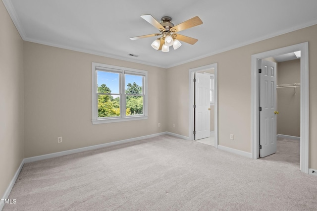 202 Bridewell Ct, Cary, NC 27518 - unfurnished bedroom with light carpet, crown molding, a spacious closet, and a ceiling fan