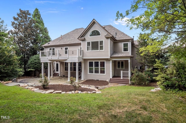 202 Bridewell Ct, Cary, NC 27518 - back of property featuring a patio, a lawn, a shingled roof, and a wooden deck