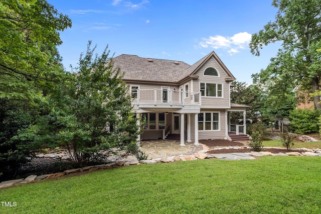 202 Bridewell Ct, Cary, NC 27518 - rear view of house with a patio, a yard, a balcony, and roof with shingles