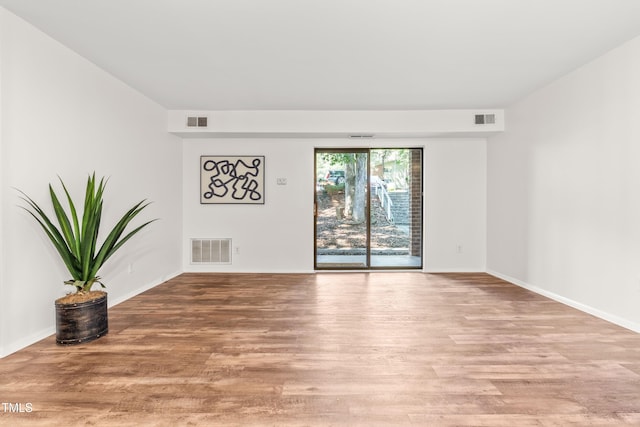 1212 Schaub Dr, Raleigh, NC 27606 - empty room featuring light wood-style flooring and baseboards