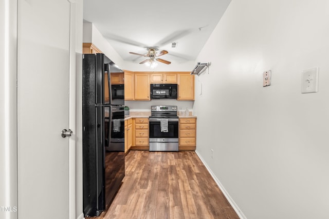 1212 Schaub Dr, Raleigh, NC 27606 - kitchen featuring black appliances, light brown cabinetry, a ceiling fan, light wood finished floors, and light countertops