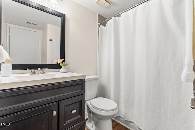 1212 Schaub Dr, Raleigh, NC 27606 - full bath with vanity, wood finished floors, and a shower with shower curtain