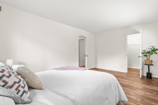 1212 Schaub Dr, Raleigh, NC 27606 - bedroom with wood finished floors and baseboards