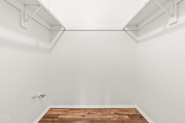 1212 Schaub Dr, Raleigh, NC 27606 - walk in closet featuring wood finished floors