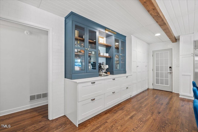 8909 Hunting Trl, Raleigh, NC 27613 - interior space featuring wood finished floors, beam ceiling, and a smoke detector