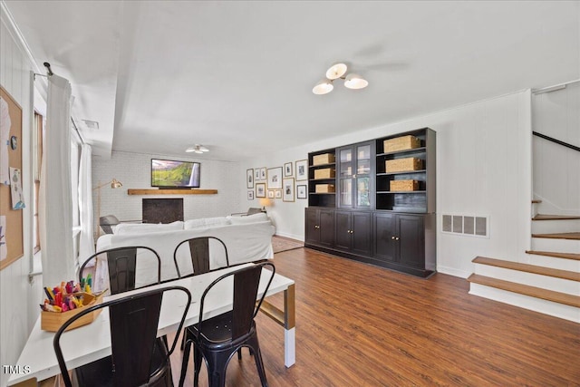 8909 Hunting Trl, Raleigh, NC 27613 - dining room featuring dark wood-style floors and stairway