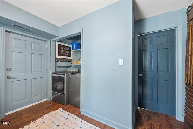 8909 Hunting Trl, Raleigh, NC 27613 - laundry room featuring independent washer and dryer and dark wood finished floors