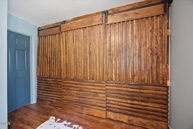 8909 Hunting Trl, Raleigh, NC 27613 - detailed view of a barn door and wood finished floors