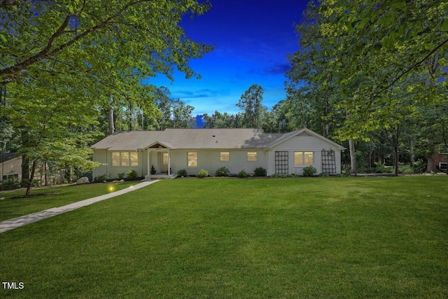 8909 Hunting Trl, Raleigh, NC 27613 - ranch-style house with a yard