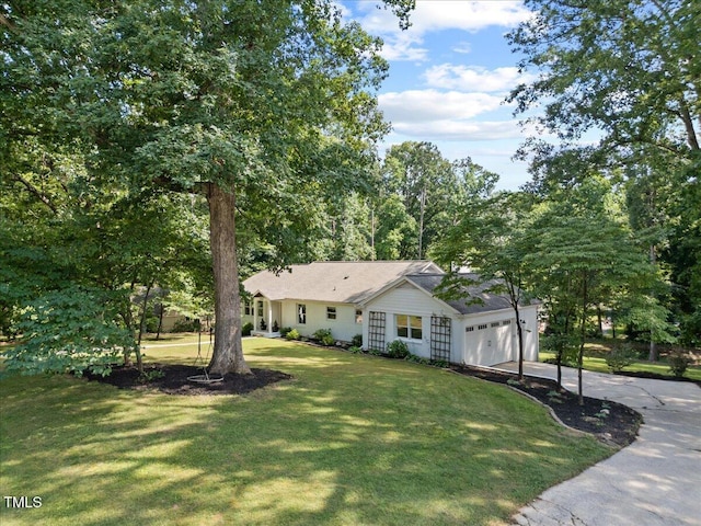 8909 Hunting Trl, Raleigh, NC 27613 - single story home featuring concrete driveway, a front lawn, and a garage