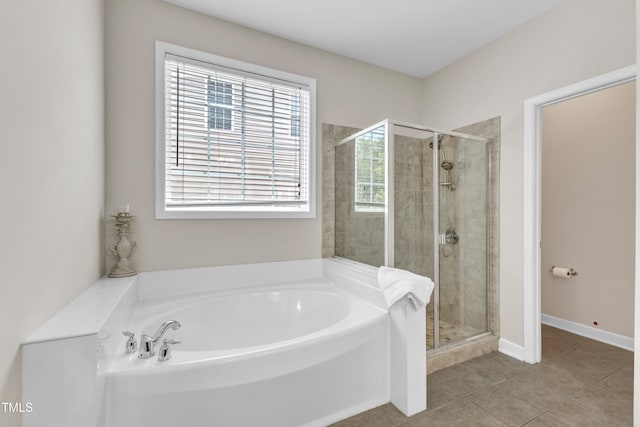 3905 Song Sparrow Dr, Wake Forest, NC 27587 - full bathroom featuring a bath, a stall shower, and tile patterned flooring