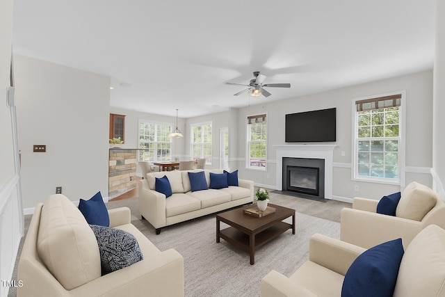 3905 Song Sparrow Dr, Wake Forest, NC 27587 - living room with healthy amount of natural light, a ceiling fan, and a fireplace with flush hearth