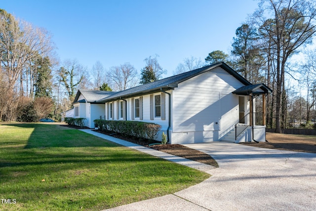 5920 Holly Dr, Raleigh, NC 27616 - view of side of home featuring a yard, crawl space, and driveway