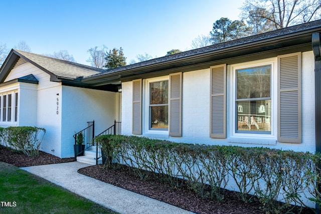 5920 Holly Dr, Raleigh, NC 27616 - view of side of property with brick siding and a shingled roof