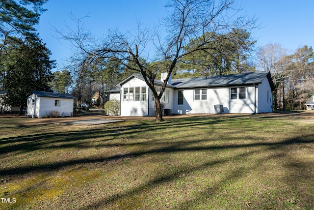 5920 Holly Dr, Raleigh, NC 27616 - back of house featuring a yard