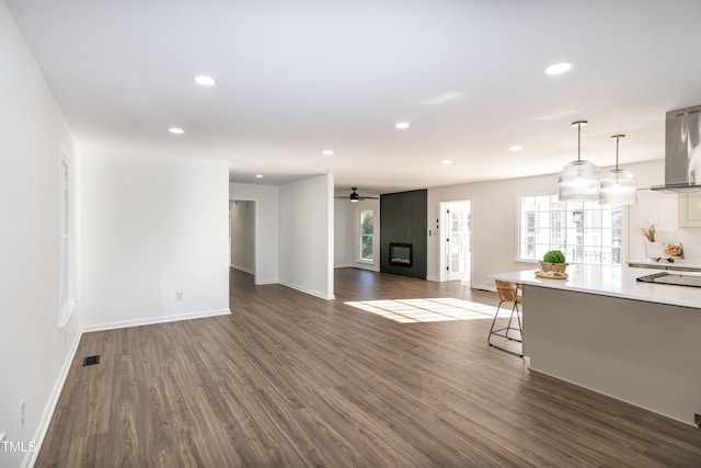 5920 Holly Dr, Raleigh, NC 27616 - living room with dark wood-type flooring, recessed lighting, a ceiling fan, and a fireplace