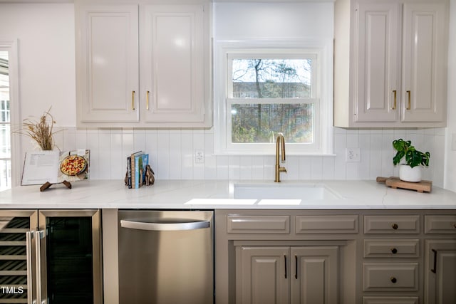 5920 Holly Dr, Raleigh, NC 27616 - kitchen with dishwasher, beverage cooler, gray cabinetry, tasteful backsplash, and light stone counters