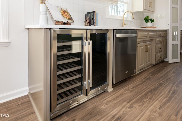 5920 Holly Dr, Raleigh, NC 27616 - bar with beverage cooler, stainless steel dishwasher, and dark wood finished floors